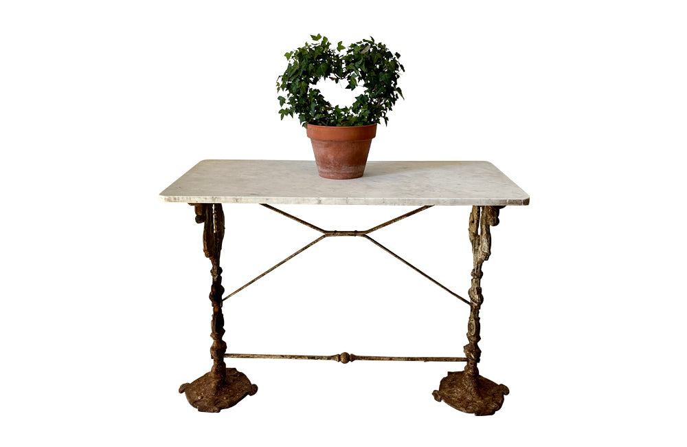 19th Century French bistro table with winged dragon supports and marble top. Great patination
