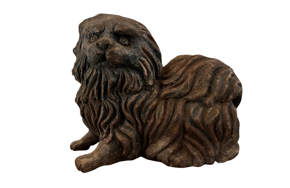 Charming cast iron sculpture of a Pekingese Dog. 