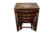 Nest of four Chinese  decorative teak occasional tables with inlaid mother of pearl inlay to the top and legs.