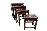 Nest of four Chinese  decorative teak occasional tables with inlaid mother of pearl inlay to the top and legs.