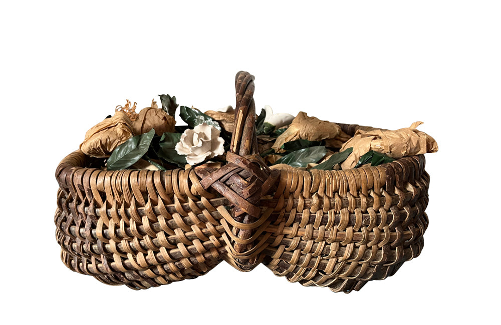 COLLECTION OF 29 CERAMIC FLOWERS IN A HARVEST BASKET