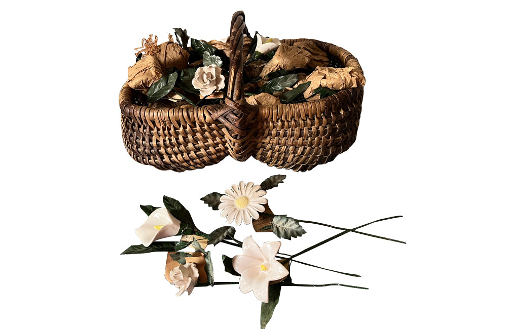 COLLECTION OF 29 CERAMIC FLOWERS IN A HARVEST BASKET