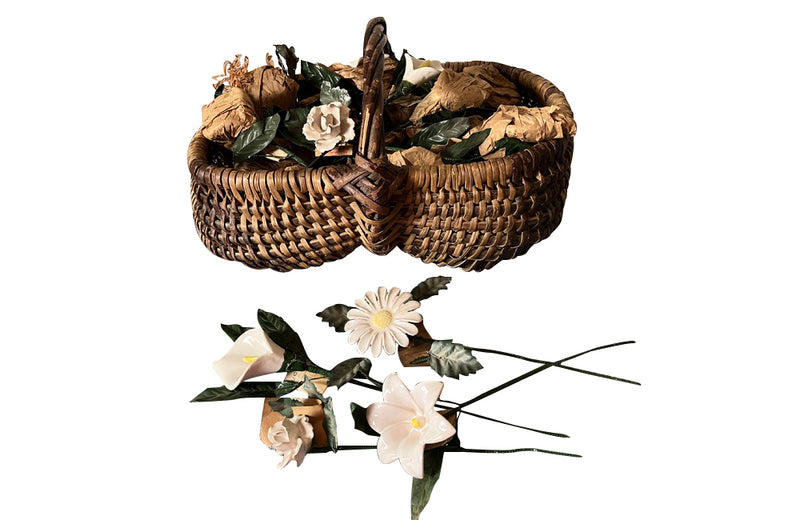 COLLECTION OF 29 CERAMIC FLOWERS IN A HARVEST BASKET