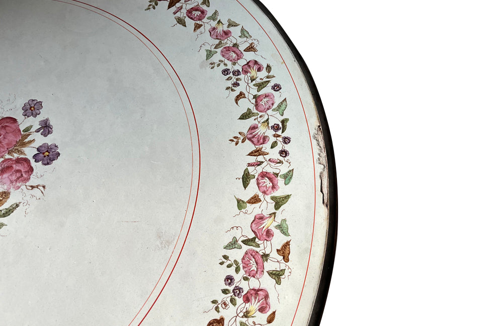 Rare, French enamel top gueridon
table with painted iron tripod base joined with central floral medaillion and
pretty enamelled top with floral motifs