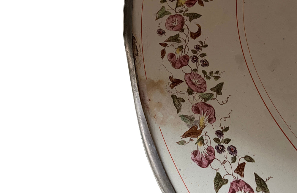 Rare, French enamel top gueridon
table with painted iron tripod base joined with central floral medaillion and
pretty enamelled top with floral motifs