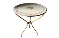 Rare, French enamel top gueridon
table with painted iron tripod base joined with central floral medaillion and
pretty enamelled top with floral motifs