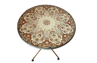 Rare, early 20th century French enamel top gueridon bistro table with iron tripod base and enamelled top featuring floral and foliate motifs.