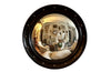 Stylish, round ebonised sorciere mirror decorated with brass balls to the surround. 