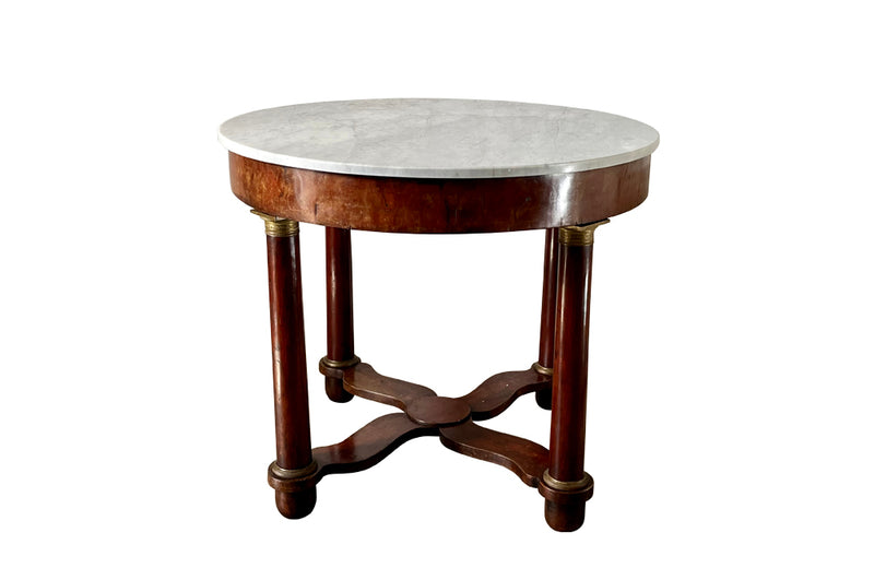 mahogany Empire centre table with Carrara marble top and stylised cross-stretcher. 