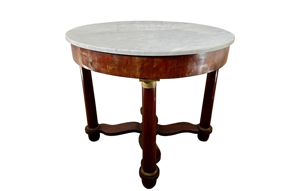 mahogany Empire centre table with Carrara marble top and stylised cross-stretcher. 