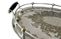 Elegant, silver plate tray with raised gallery and ebony handles engraved with floral and foliate decoration and empty central cartouche bearing the makers mark of Mackay Bros, Dundee.