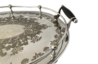 Elegant, silver plate tray with raised gallery and ebony handles engraved with floral and foliate decoration and empty central cartouche bearing the makers mark of Mackay Bros, Dundee.