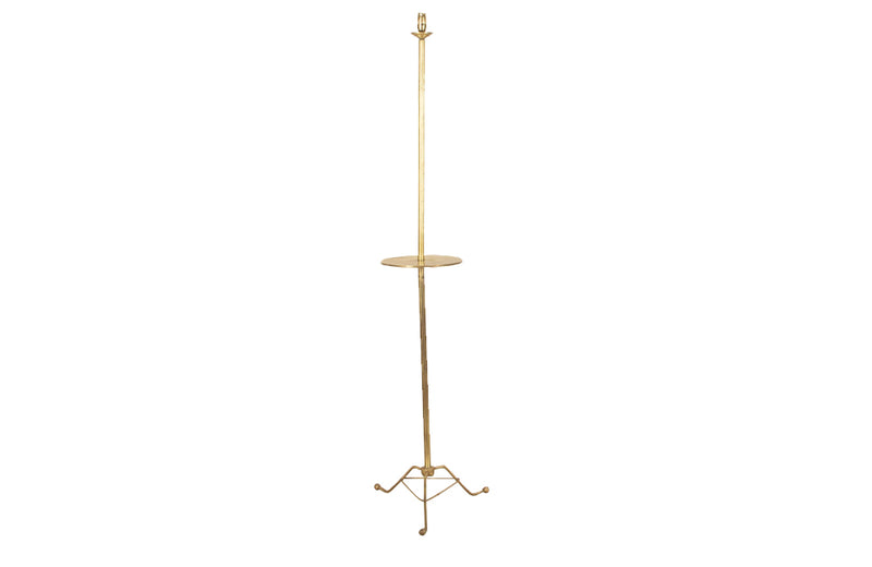 Stylish and practical Mid-Century French brass floor lamp with integrated side table and tripod base