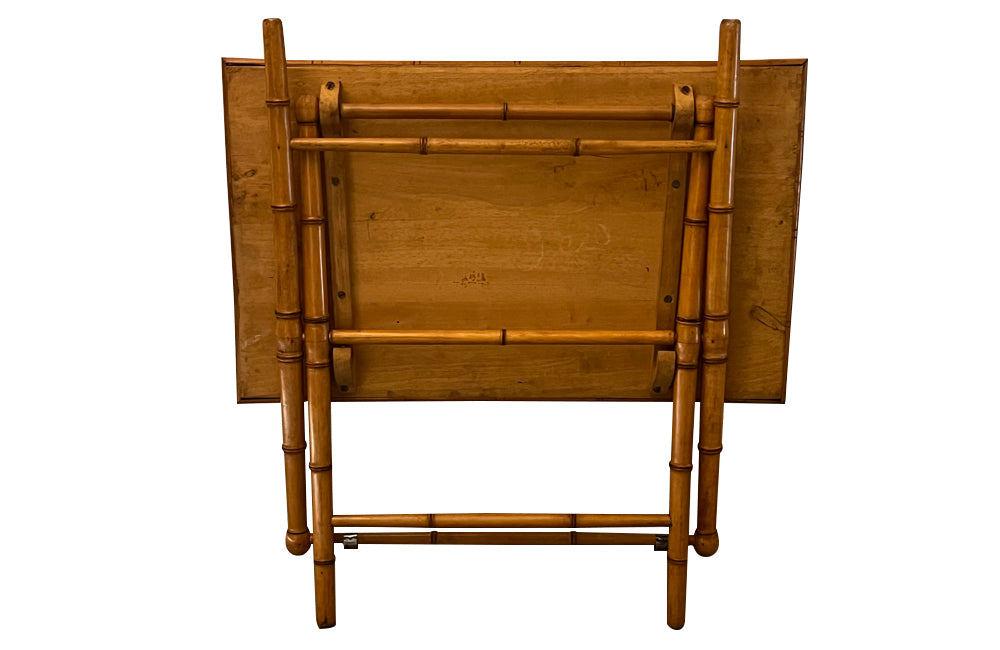 Folding faux bamboo table with coloured rattan top.