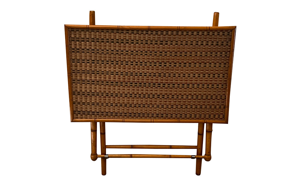 Folding faux bamboo table with coloured rattan top.