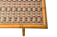 Folding faux bamboo table with coloured rattan top.