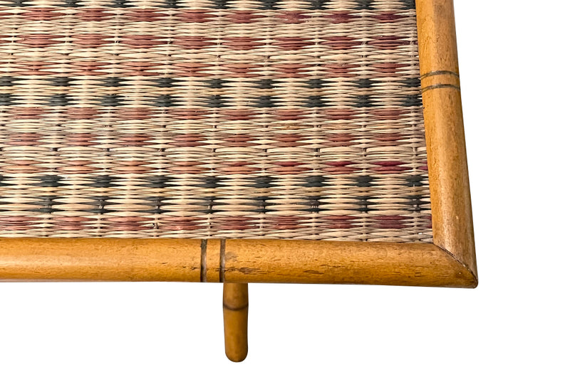 Folding faux bamboo table with coloured rattan top.