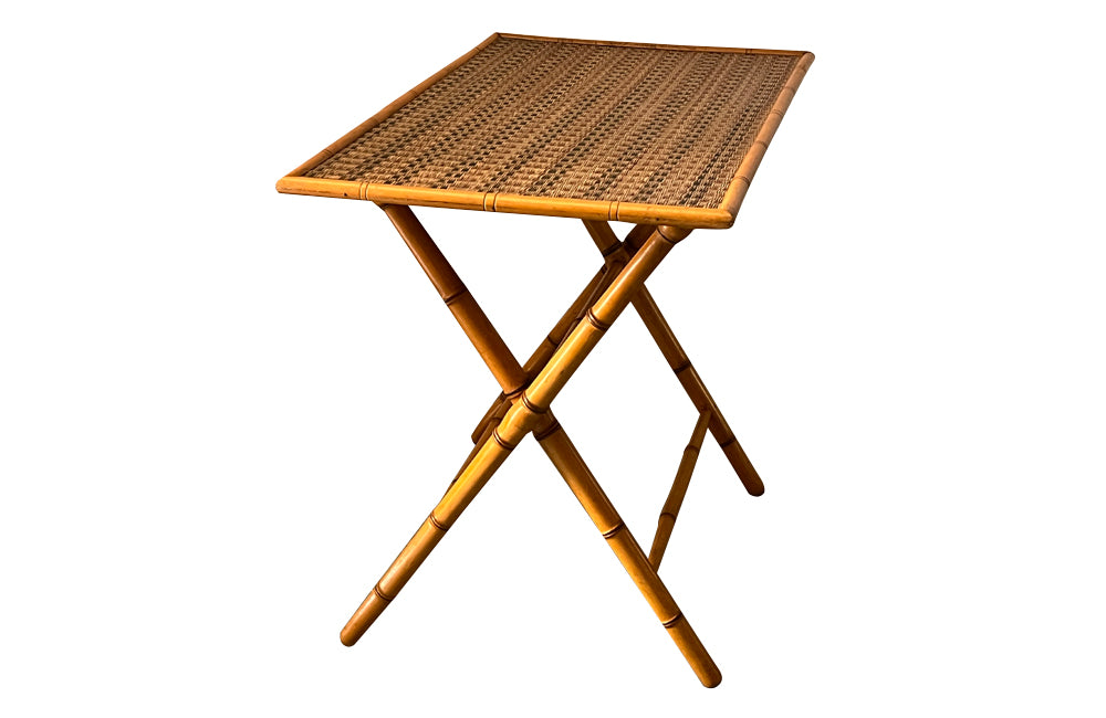 Folding faux bamboo table with coloured rattan top.