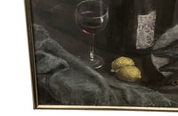 Still-life pastel of three fish on a plate with lemons , three wine bottles, a glass of wine,  basket and a draped tablecloth