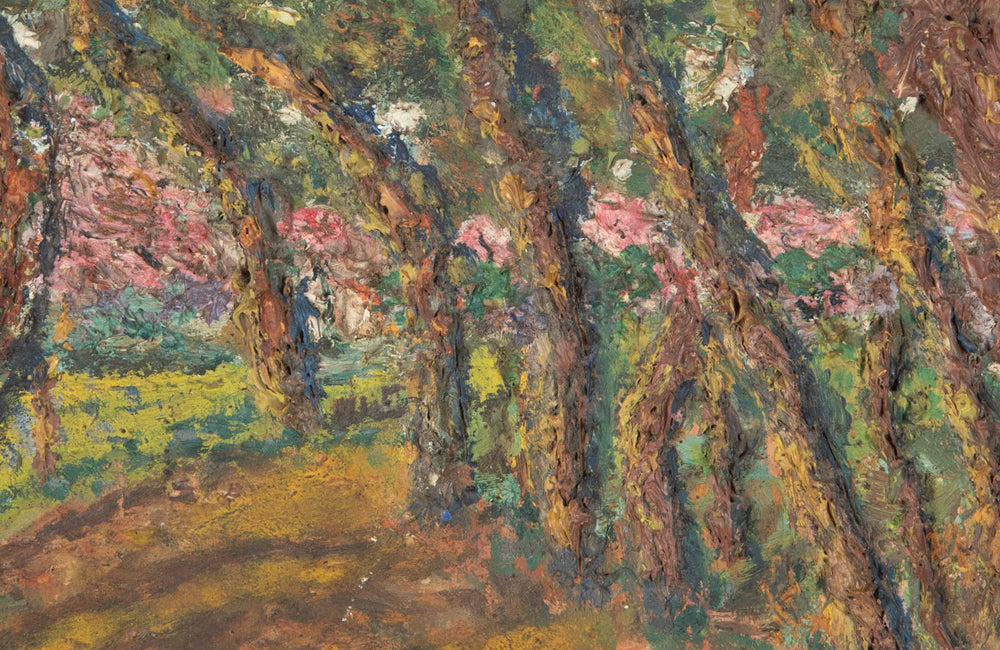 Oil on card painting of a shady forest path with pink blossoming trees signed by the artist to the lower right, Cohen