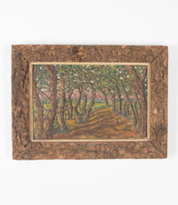 Oil on card painting of a shady forest path with pink blossoming trees signed by the artist to the lower right, Cohen