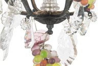 20th Century chandelier with bunches of coloured glass grape drops and brass vine leaves.