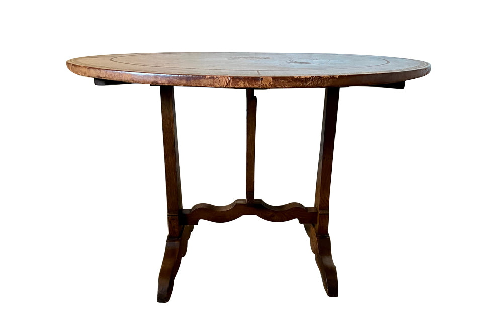 French,19th century, vineyard table with nicely worn embossed leather top .