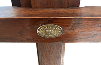 Early 20th Century French oak artist's easel bearing the brass label 'L. Berville Paris 25 Chausee d'Antin'.