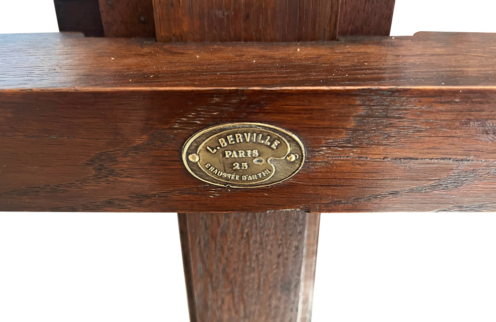 Early 20th Century French oak artist's easel bearing the brass label 'L. Berville Paris 25 Chausee d'Antin'.