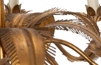 Large mid 20th century gilt metal chandelier with palm fronds surrounding a central ringed stem in the manner of Maison Jansen.