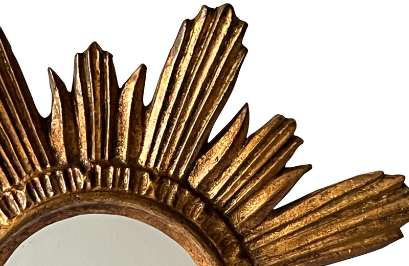 Mid 20th Century decorative Spanish giltwood sunburst mirror with rays. 