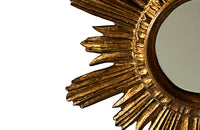 Mid 20th Century decorative Spanish giltwood sunburst mirror with rays. 