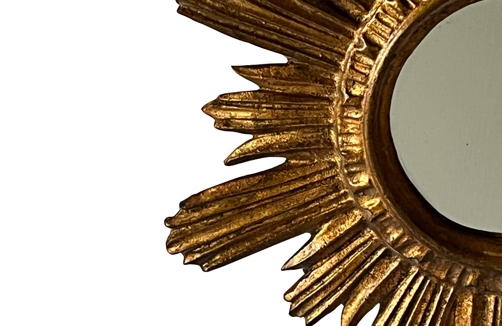 Mid 20th Century decorative Spanish giltwood sunburst mirror with rays. 
