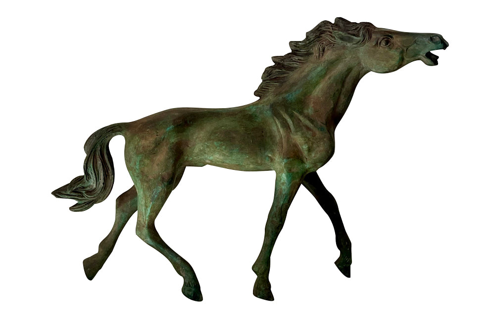 Decorative mid-20th Century French brass horse statue in a patinated bronze finish.