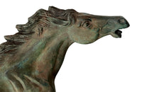 Small decorative mid-20th Century French brass horse statue in a patinated bronze finish.