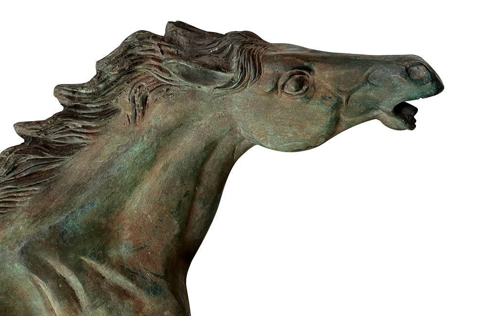 Small decorative mid-20th Century French brass horse statue in a patinated bronze finish.