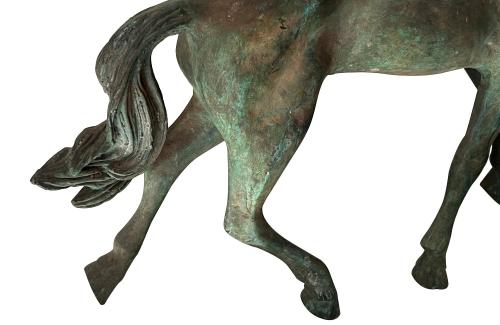 Small decorative mid-20th Century French brass horse statue in a patinated bronze finish.
