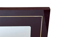 1970s mirror with burgundy acrylic frame and brass banding. Italian