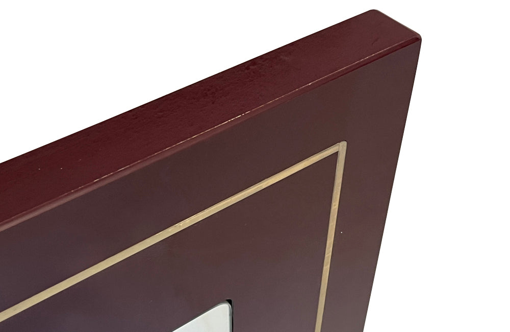 1970s mirror with burgundy acrylic frame and brass banding. Italian