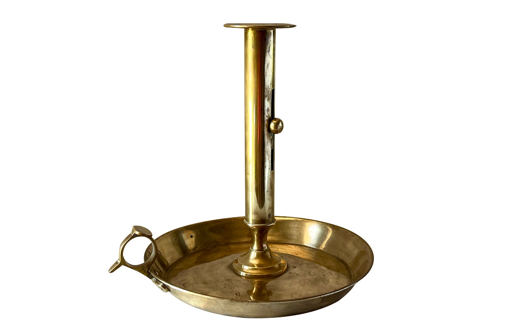 Large brass candle holder in the form of a French 'Rat de Cave' or cellar candlestickw ith adjustable height
