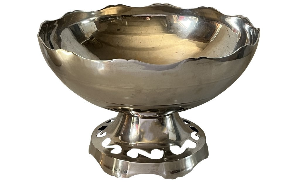 Large French silver plate champagne cooler vasque with the rim and foot shaped and the base decorated with cut out shapes.