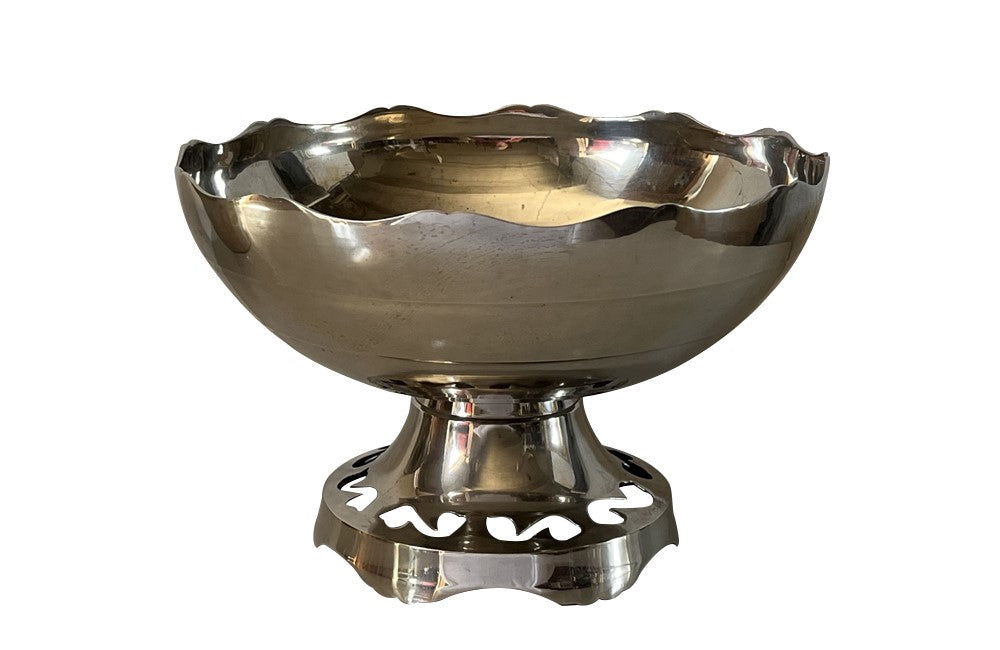 Large French silver plate champagne cooler vasque with the rim and foot shaped and the base decorated with cut out shapes.