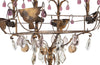 Beautiful early 20th century large gilt metal cage chandelier with clear and coloured glass drops, foliate embellishments and draped tassle motifs.