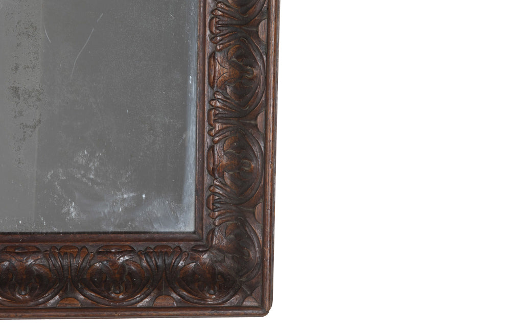 Large 19th Century French oak mirror with a beautifully deep carved oak acanthus motif frame.