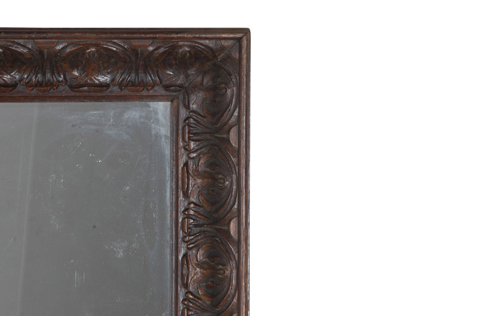 Large 19th Century French oak mirror with a beautifully deep carved oak acanthus motif frame.