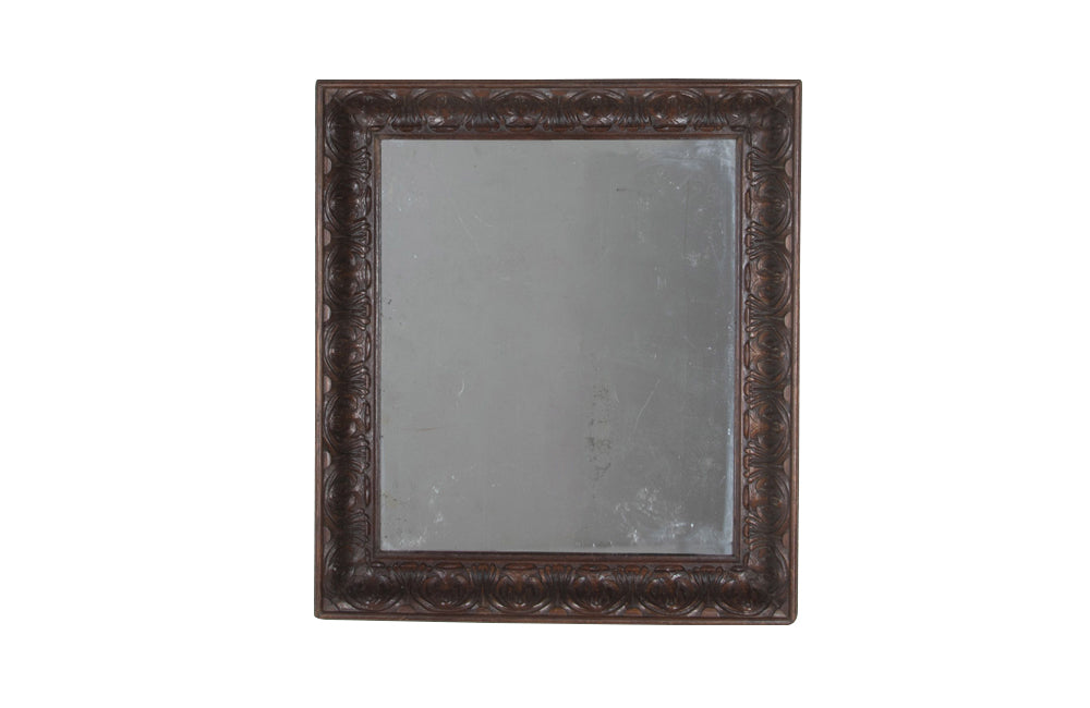 Large 19th Century French oak mirror with a beautifully deep carved oak acanthus motif frame.