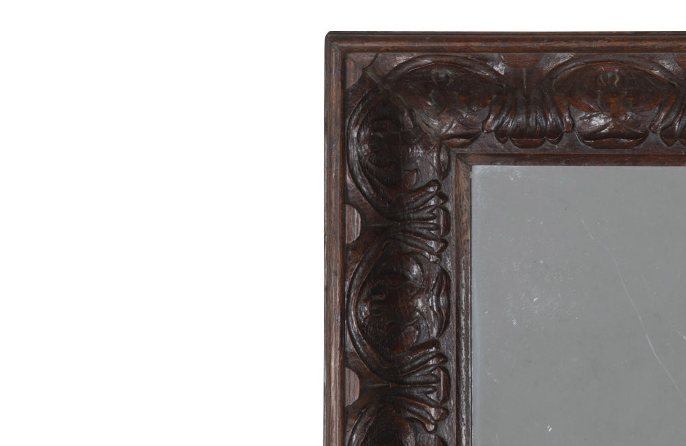 Large 19th Century French oak mirror with a beautifully deep carved oak acanthus motif frame.