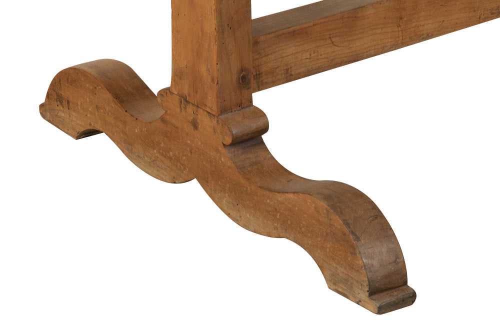 An elegant 19th Century French vigneron table crafted from solid cherry.