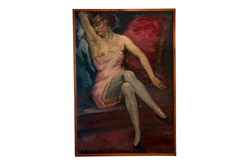 Large Mid-Century French oil on canvas painting of a seated female in gartered stockings wearing a pink satin and lace slip signed by the artist Jean Perret to the lower left in a simple wooden frame