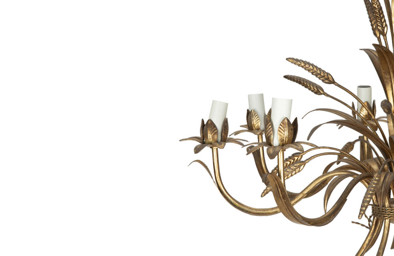 Large Mid-Century French, Hollywood Regency style, gilt tole wheat sheaf chandelier with eight curved leaved branches bulb holders